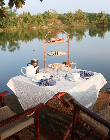 A private breakfast set beside the water