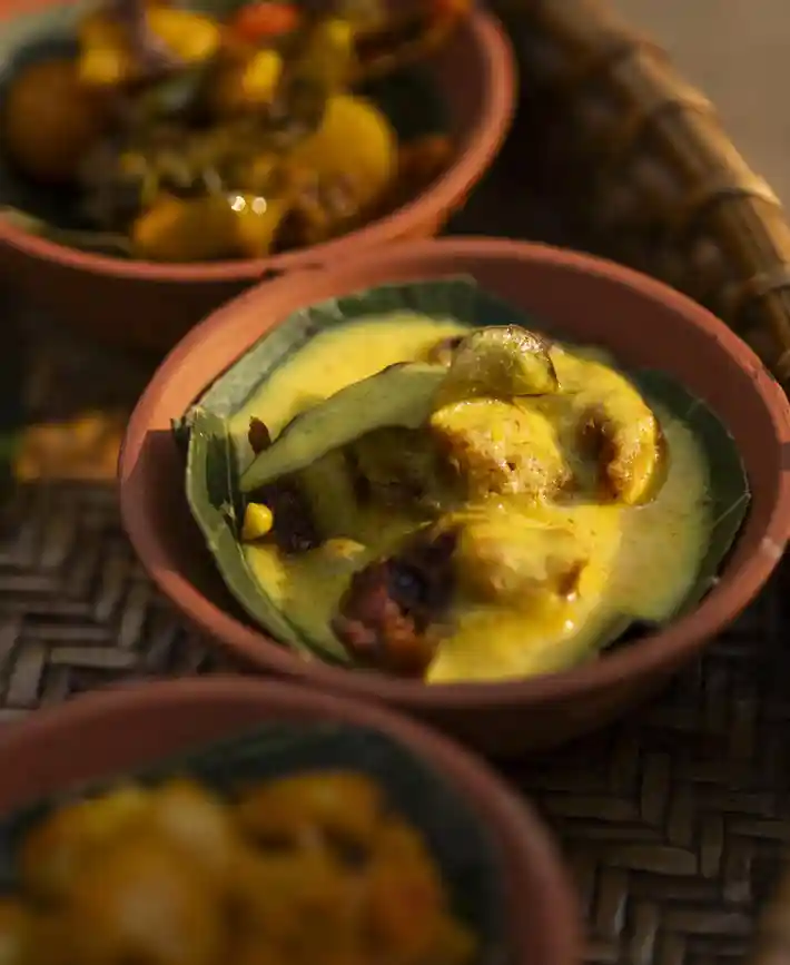 Regional dishes served in traditional clay bowls