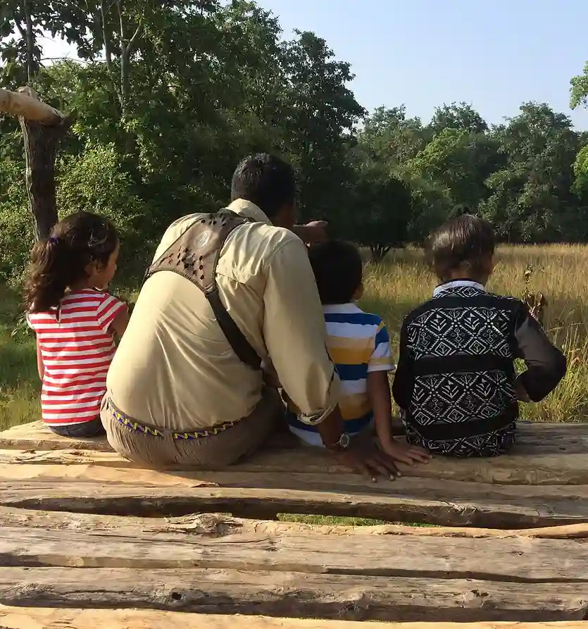 Children exploring the forest with a Forsyth Lodge naturalist