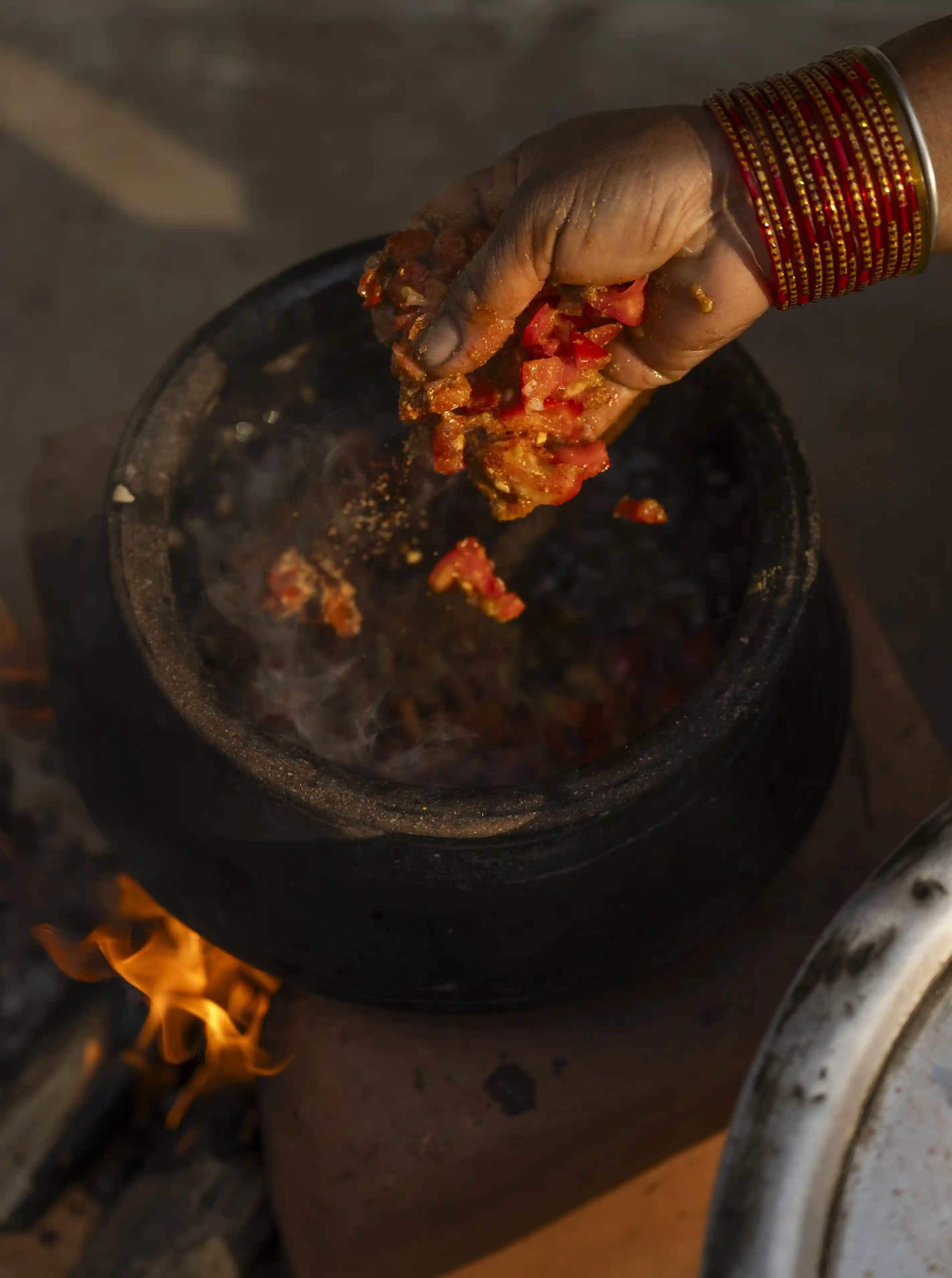 Ingredients being crushed for traditional cooking